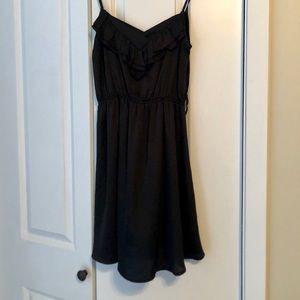 Strappy black dress with ruffle detail!